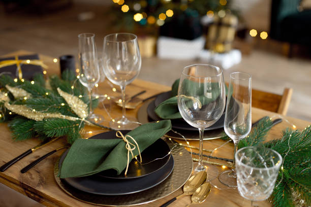istock Table served for Christmas dinner in living room, close-up view, table setting, Christmas decoration 1186157748