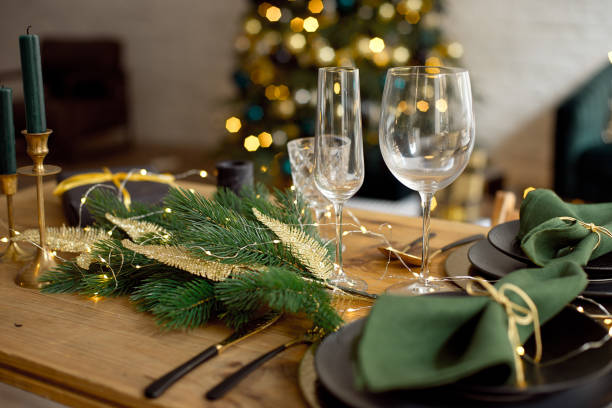istock Table served for Christmas dinner in living room, close-up view, table setting, Christmas decoration 1186157750