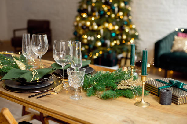istock Table served for Christmas dinner in living room, close-up view, table setting, Christmas decoration 1186157758