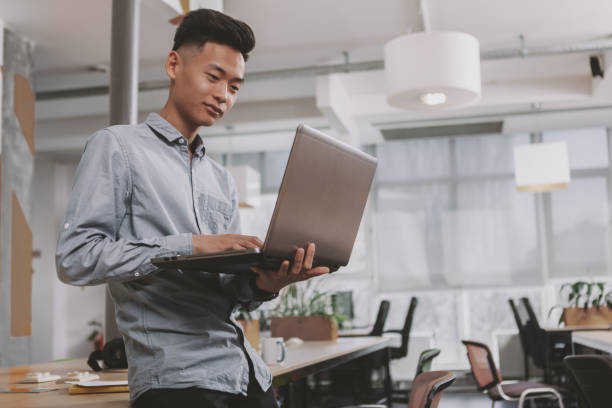 istock Young Asian entrepreneur at the office 1186157859