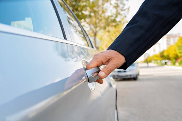 istock Businessman opening a car door 1186158841