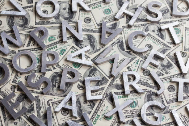 istock a random metal letters on us dollar background 1186159091