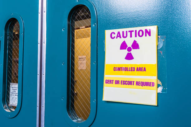 Ionizing radiation warning symbol displayed at the entrance to a laboratory; Message posted: "Controlled Area; Gert or Escort Required"; Gert stands for General Employee Radiological Training Ionizing radiation warning symbol displayed at the entrance to a laboratory; Message posted: "Controlled Area; Gert or Escort Required"; Gert stands for General Employee Radiological Training california fuchsia stock pictures, royalty-free photos & images