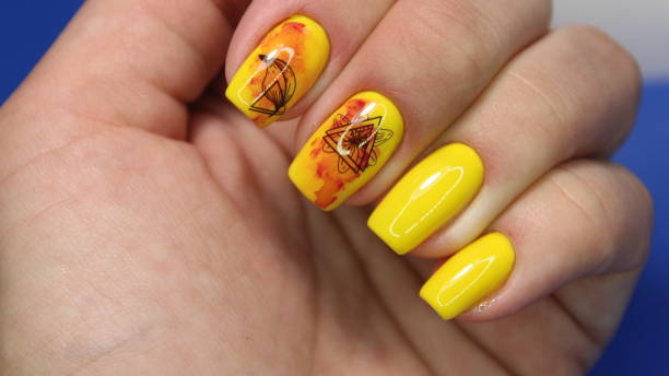 istock Fashionable yellow manicure 1186166850