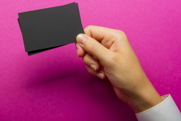 istock Hand holding white business card on white background 1186168961