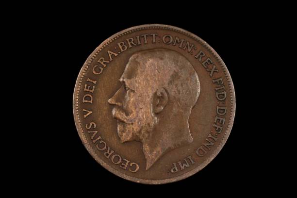 istock An old British penny isolated on a black background 1186169322