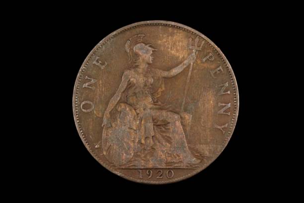 istock An old British penny isolated on a black background 1186169397