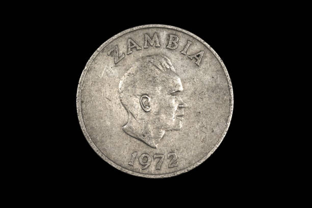 istock An old coin from Zambia shot on a black background 1186169415