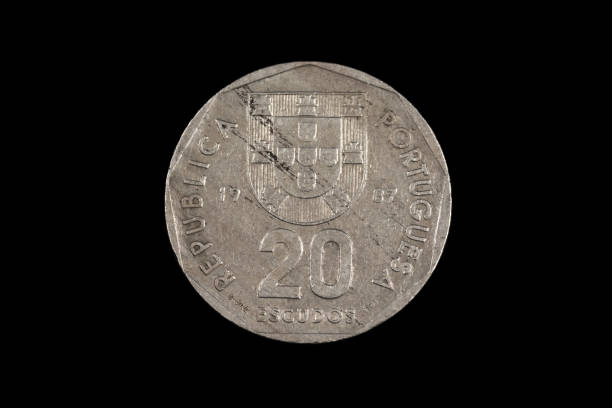 istock An old Portuguese coin isolated on a black background 1186169448