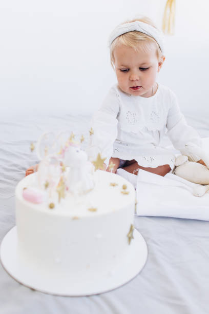 istock The child eats cake with appetite. Birthday baby. 1186169513