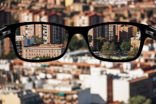 istock Myopia - Eyeglasses focusing a city 1186169611