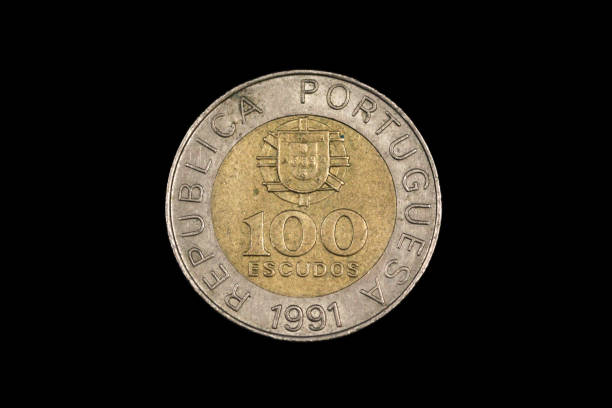 istock An old Portuguese coin isolated on a black background 1186169673