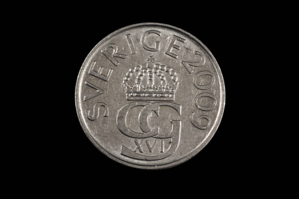 istock An old Swedish krone coin on a black background 1186170213