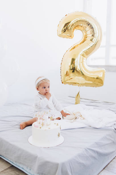 istock The child eats cake with appetite. Birthday baby. 1186170244