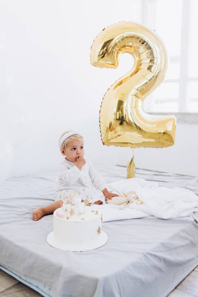 istock The child eats cake with appetite. Birthday baby. 1186170281