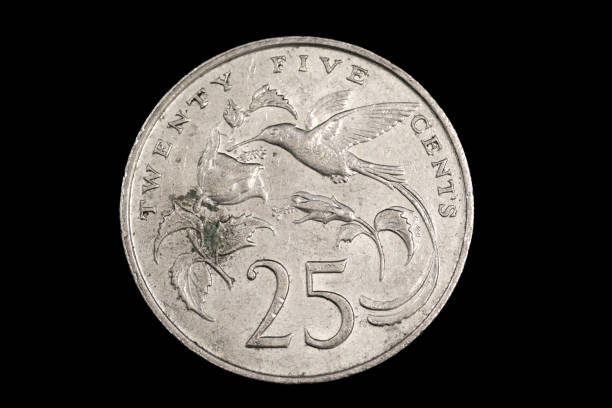 istock An old Jamaican coin isolated on a black background 1186170368