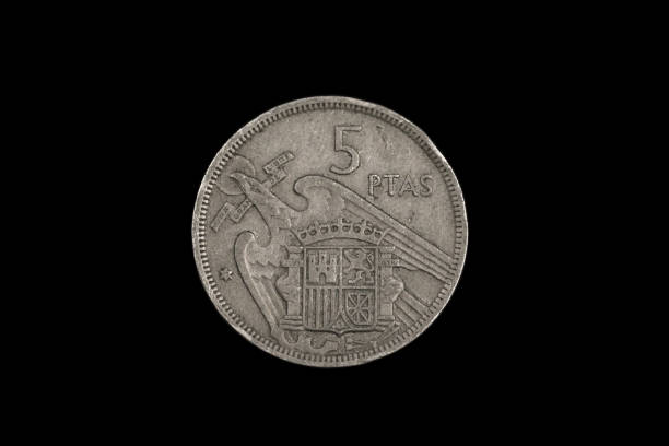 istock An old Spanish coin featuring Francisco Franco on a black background 1186170386