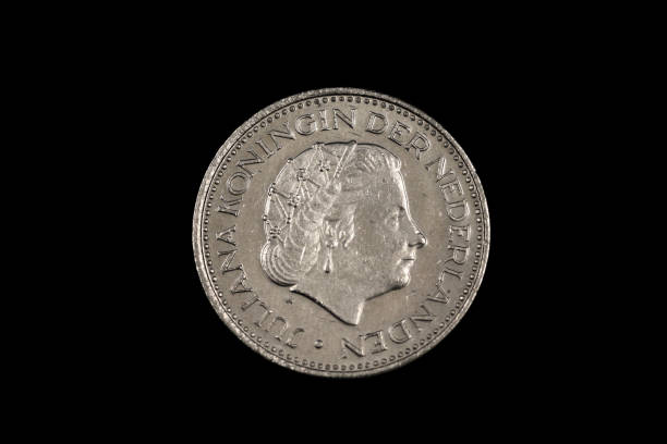 istock An old one Dutch guilder coin on black 1186170393