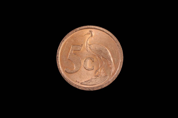 istock A copper colored South African coin shot on a black background 1186170409