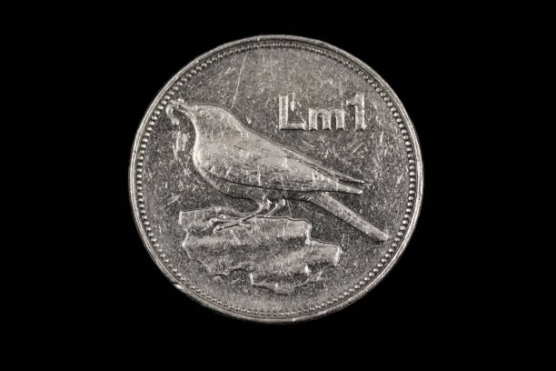 istock An old Maltese coin isolated on a black background 1186170413