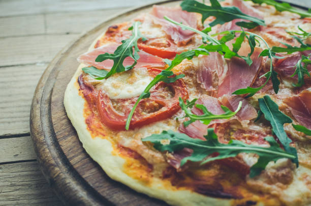 istock Italian pizza with prosciutto and arugula 1186170732