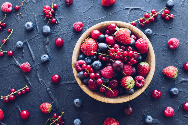 istock Bowl of various ripe berries 1186170786