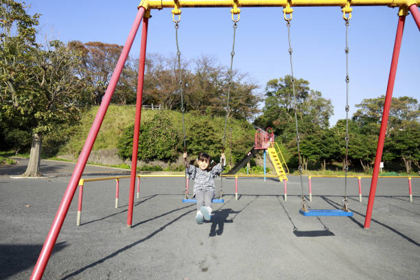istock Japanese girl on the swing (5 years old) 1186170926