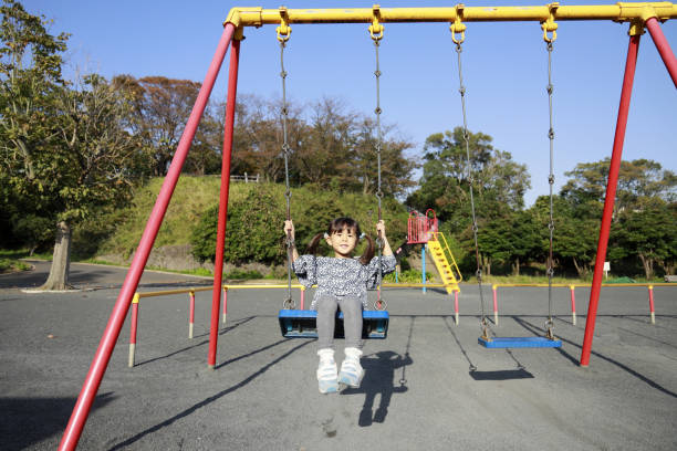 istock Japanese girl on the swing (5 years old) 1186171861