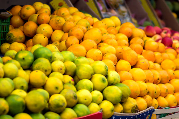 istock Fresh limes and oranges at the fruit and vegetable market 1186173522