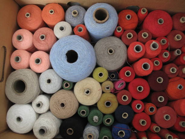 Embroidery accessories for a variety of colors, such as yarn, needle and buttons brought together for workshop class.