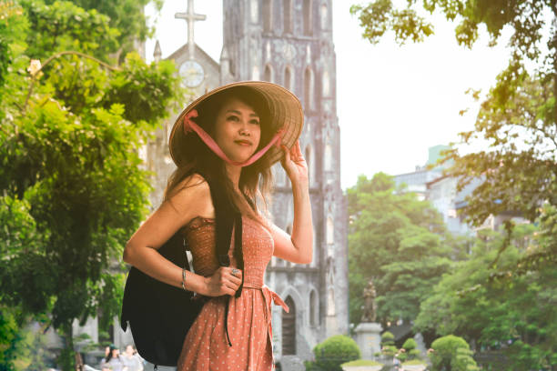 istock Woman with backpack travelling in Hanoi 1186174832