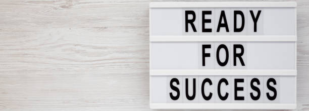 istock 'Ready for success' words on a modern board on a white wooden surface, top view. Overhead, from above, flat lay. Copy space. 1186175178