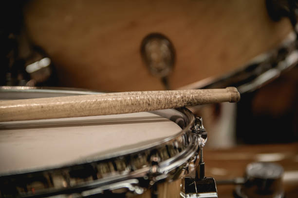 istock Pair of drumsticks sitting on a snare drum 1186175300