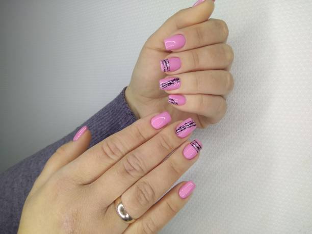 istock fashionable pink nails 1186177196