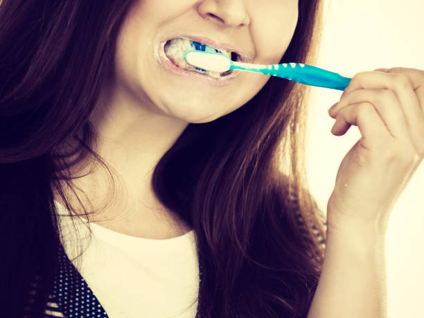 istock Woman brushing cleaning teeth. 1186178768