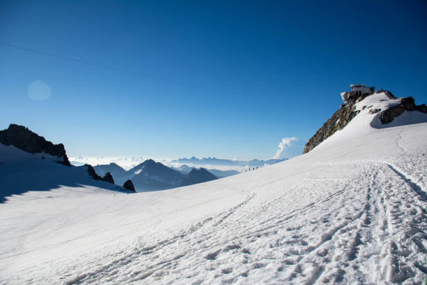 Looking at Rifugio Torino Looking at Rifugio Torino dent du geant stock pictures, royalty-free photos & images