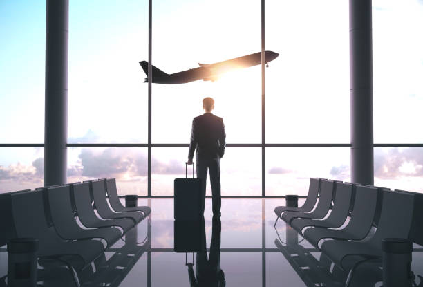 istock Businessman standing in airport 1186180582
