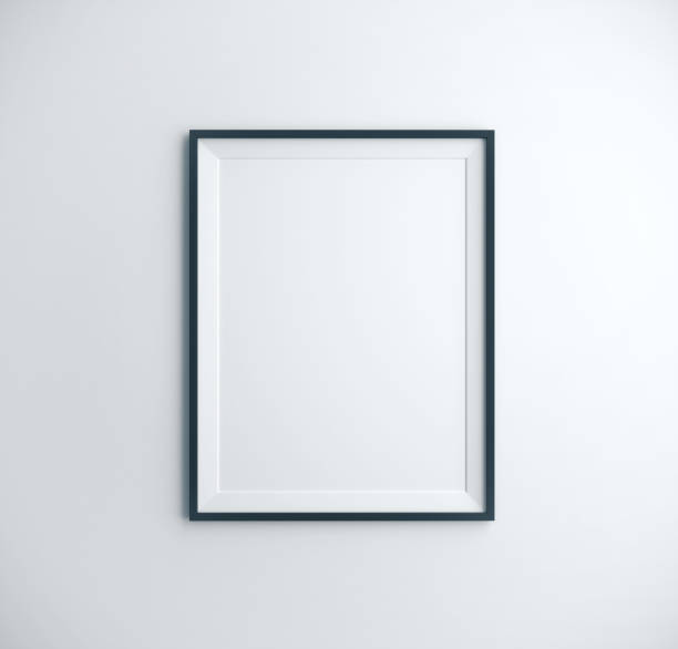 istock poster picture frame hanging on wall 1186180742