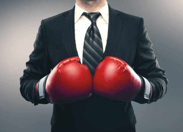 istock Businessman in red boxing gloves 1186180966