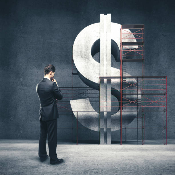 istock businessman standing in concrete room 1186180977
