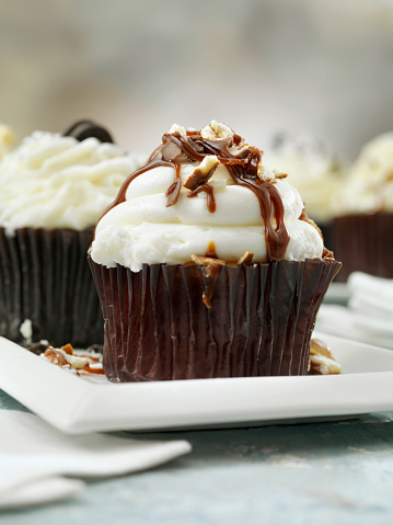 Chocolate Buttercream Cupcakes with Walnuts and a Chocolate Drizzle