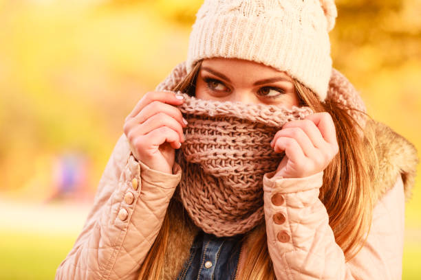 istock Woman with scarf and cap. 1186183935