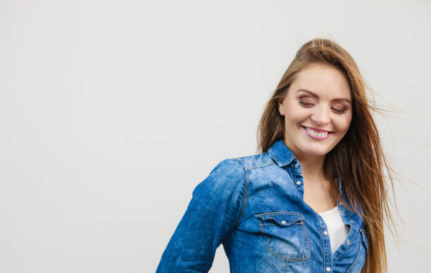 istock Happy smiling woman wearing jeans 1186184031