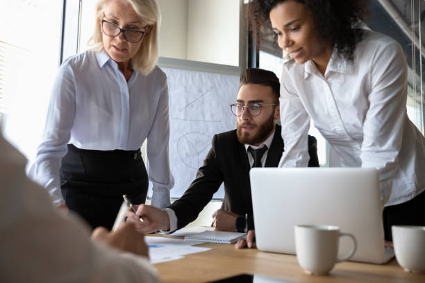 istock Busy multiracial office workers brainstorming at group meeting in boardroom 1186185239