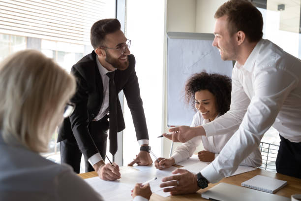 istock Diverse businesspeople working together on common business project finances 1186185246