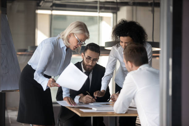 istock Multi-ethnic businesspeople financiers analyzing financial statistics work results 1186185249