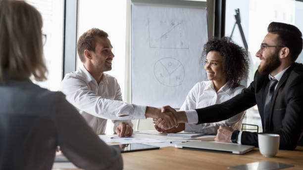 istock Different ethnicity businessmen shaking hands starting negotiations 1186185262