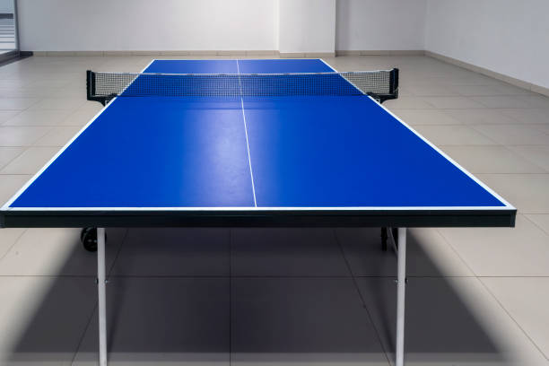 istock Ping pong table with net close-up. Blue ping pong table close-up. 1186186047