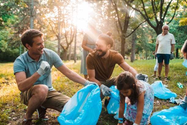 istock Families cleaning the park together 1186187272