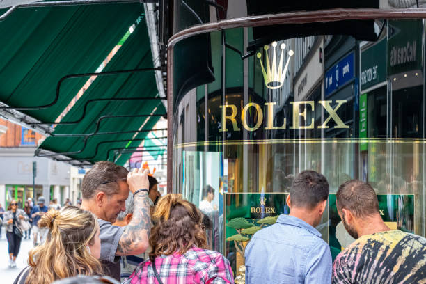 People looking watches at the Rolex store in the city center of Dublin, Ireland. stock photo